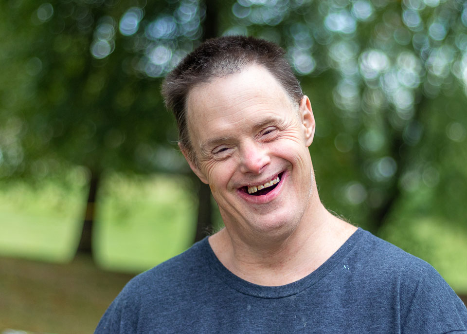 Peopleofwillowsway Man wearing a blue shirt, smiling